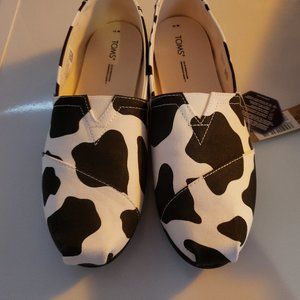 Toms new with tags cow print shoes